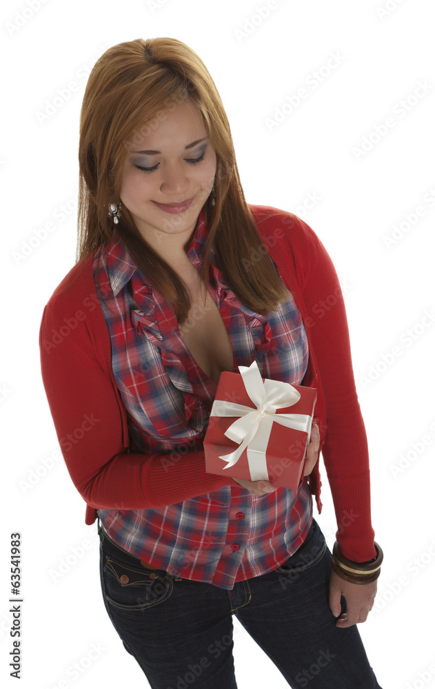 Fototapeta premium Beautiful young woman smiling at a present view from above