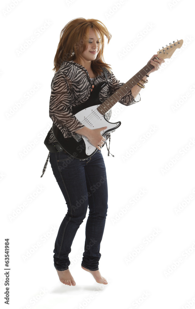 Young rock lady jumping with an electric guitar Young rock lady jumping with an electric guitar