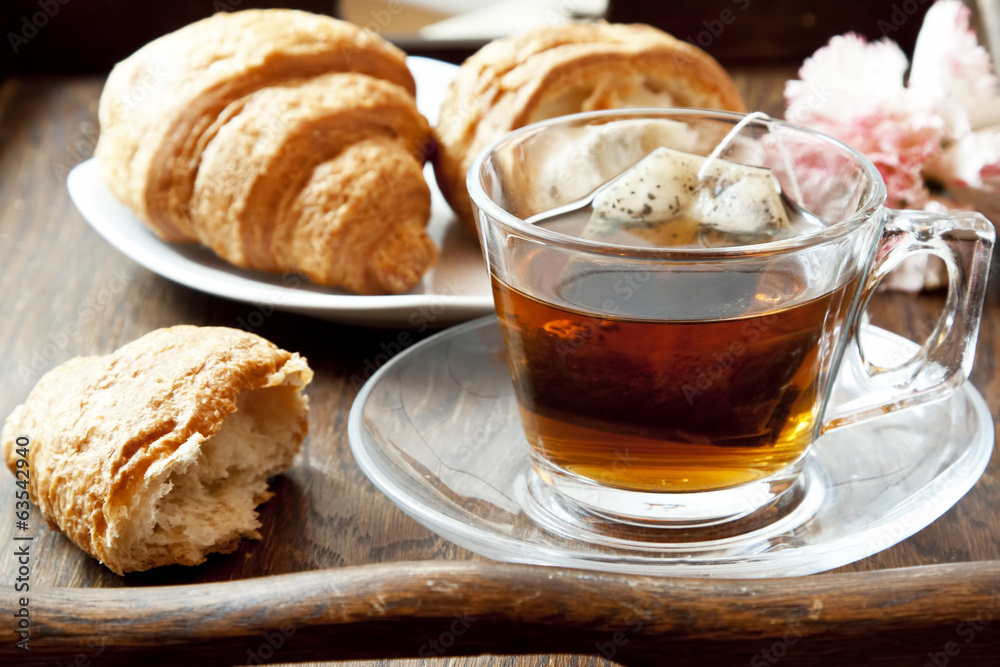 Tea in Transparent Cup with Croissants