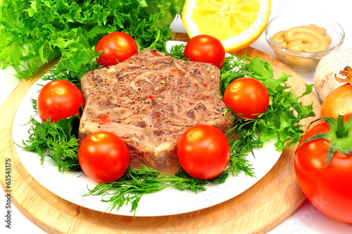 jellied meat with fresh herbs and cherry tomatoes
