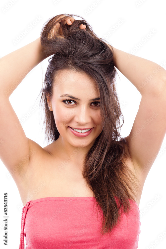 Fototapeta premium Portrait of a beautiful young woman with long brown hair
