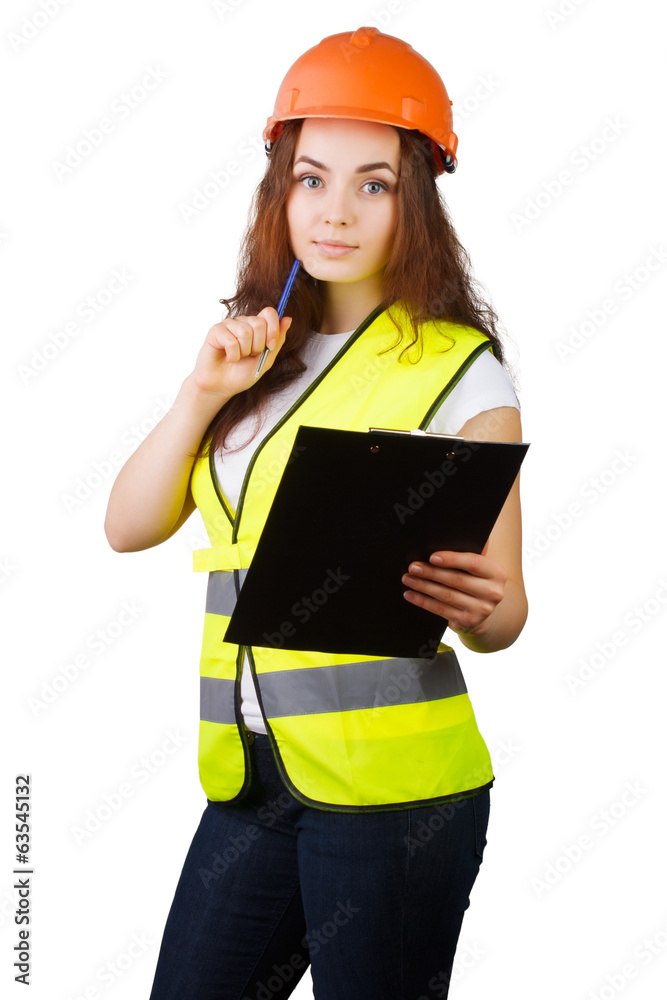 The girl the builder with a tablet for papers and the handle. The girl the builder with a tablet for papers and the handle.