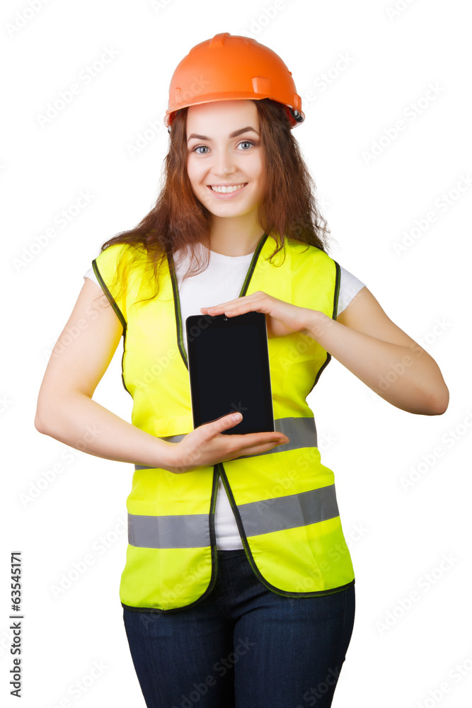 Woman builder in helmet and with electronic tablet in hands Woman builder in helmet and with electronic tablet in hands