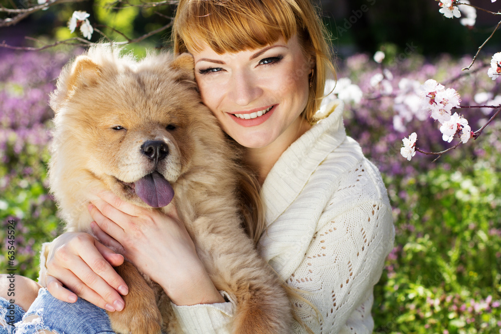 Portrait of a woman with her dog outdoors Portrait of a woman with her dog outdoors