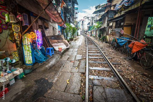 Railway crossing the street in city, Vietnam.