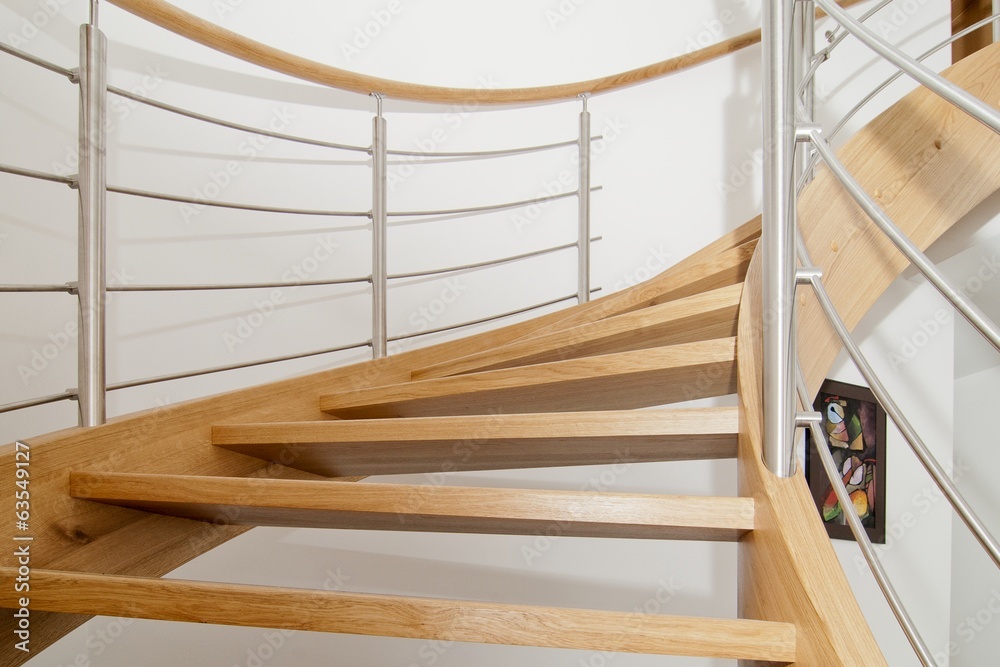 Curved wooden staircase with stainless steel elements - obrazy, fototapety, plakaty 