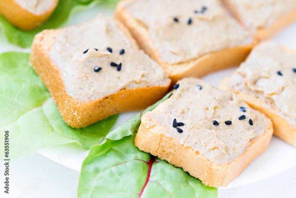 Slice of toasted baguette with creamy tuna paste Slice of toasted baguette with creamy tuna paste