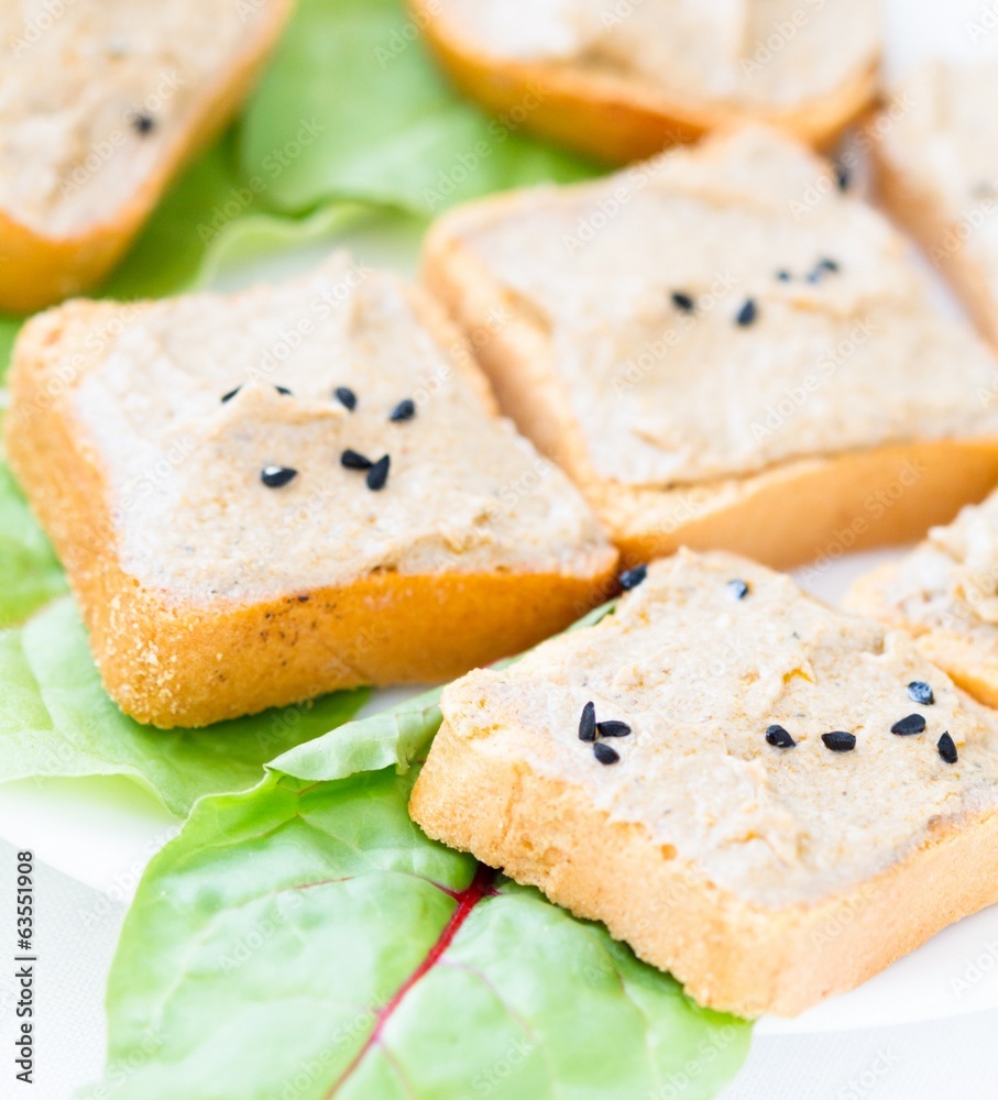 Slice of toasted baguette with creamy tuna paste Slice of toasted baguette with creamy tuna paste