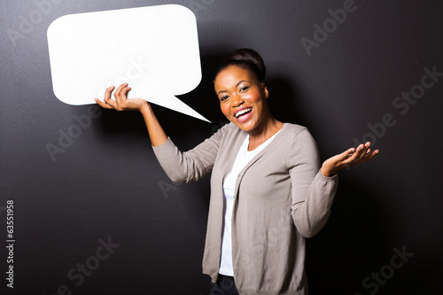 african girl holding blank speech bubble