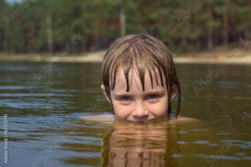 Fototapeta Naklejka Na Ścianę i Meble -  Close up of young beautiful girl with beautiful smile in water