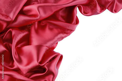 Rippled red silk fabric texture on white background. Copy space