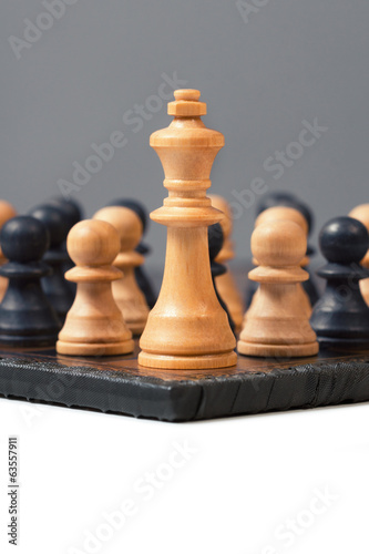 group of Pawns fight against the King