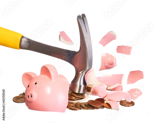 Money Concept. Hammer breaking Piggy Bank
