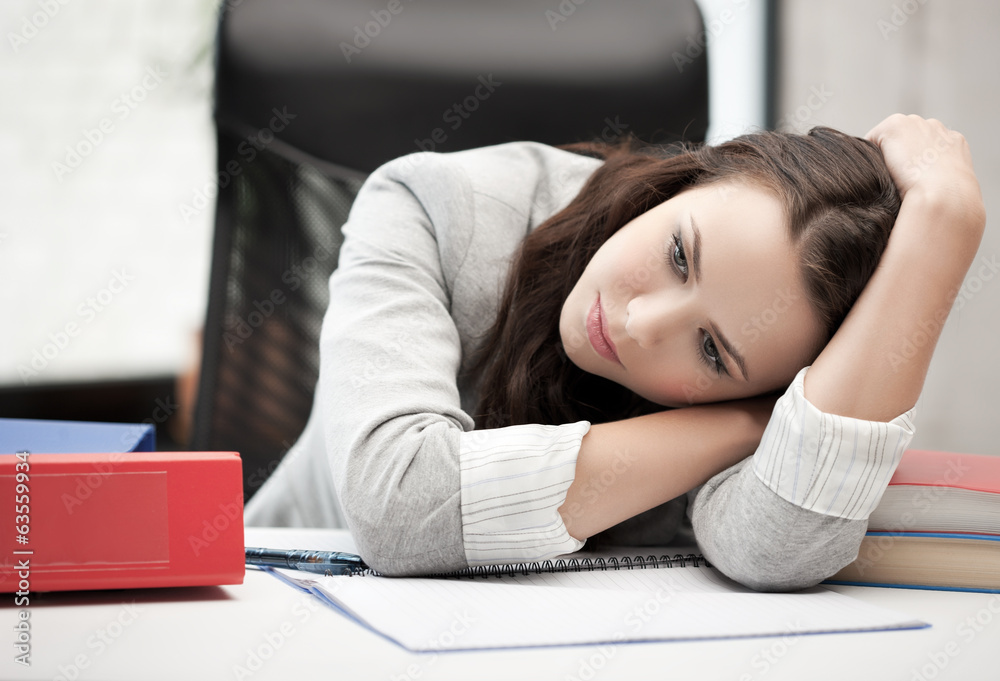 bored and tired woman behid the table bored and tired woman behid the table