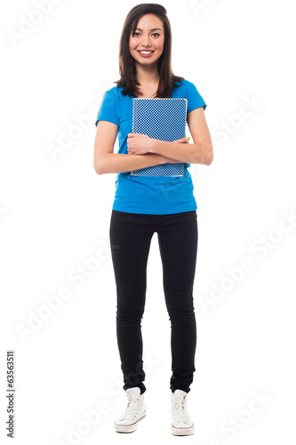 Beautiful young woman with notebook