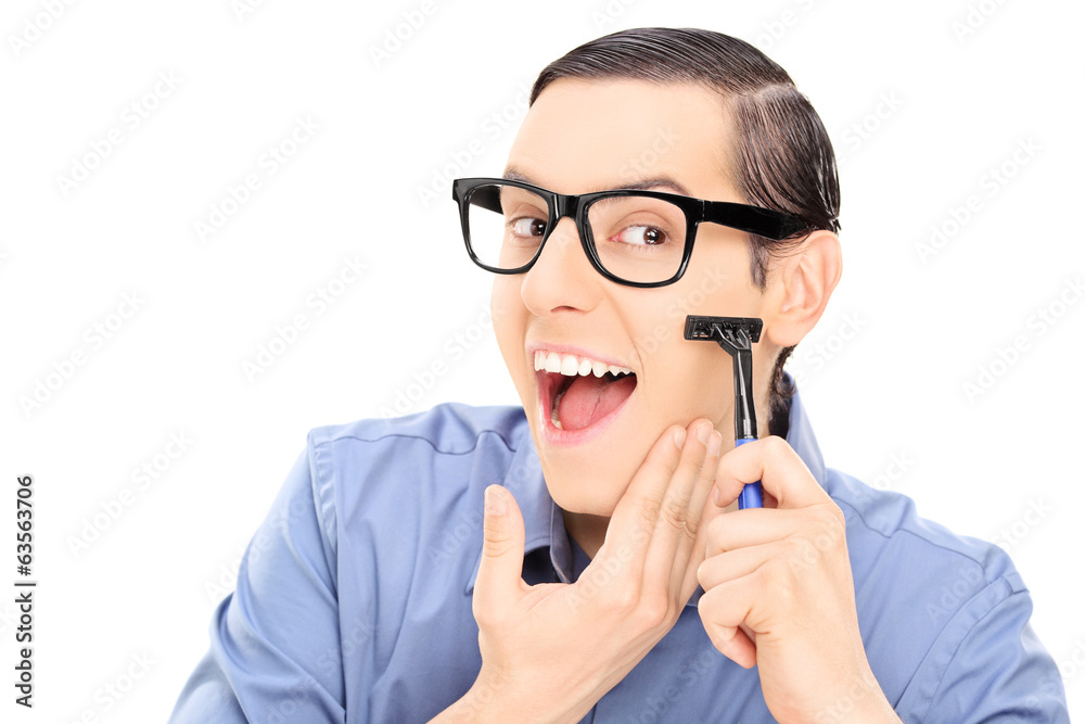 Young man shaving Young man shaving