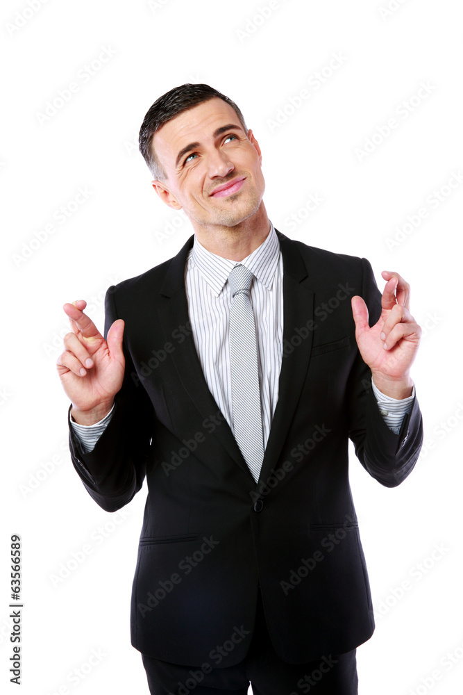 Businessman making a wish isolated on white background
