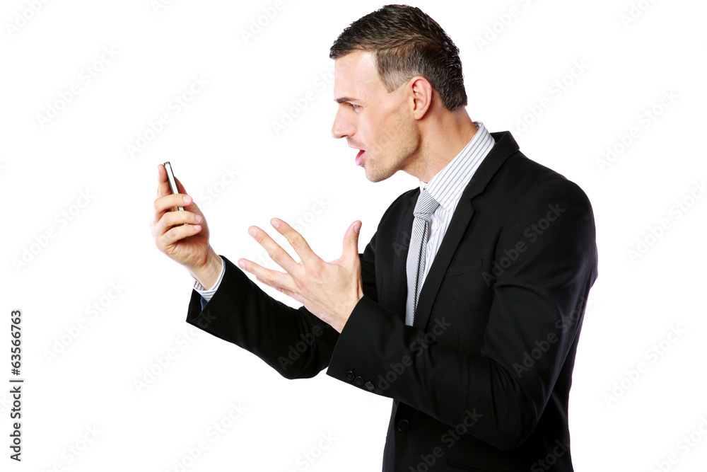 Angry businessman yelling on his cell phone Angry businessman yelling on his cell phone