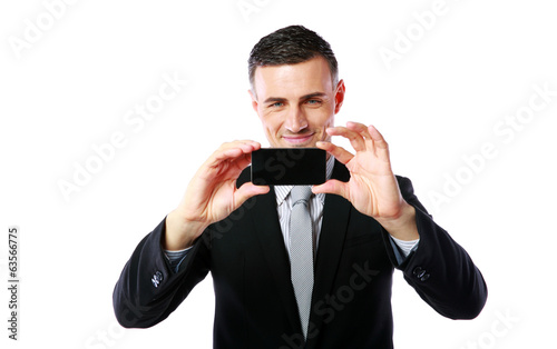 businessman making photo with his cellphone 