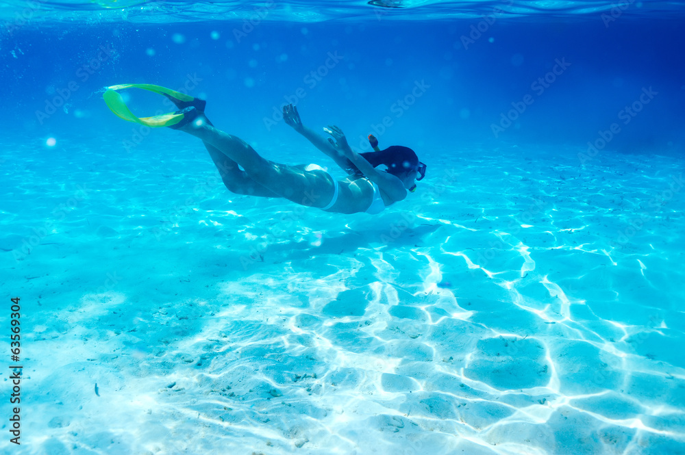 Woman with mask snorkeling