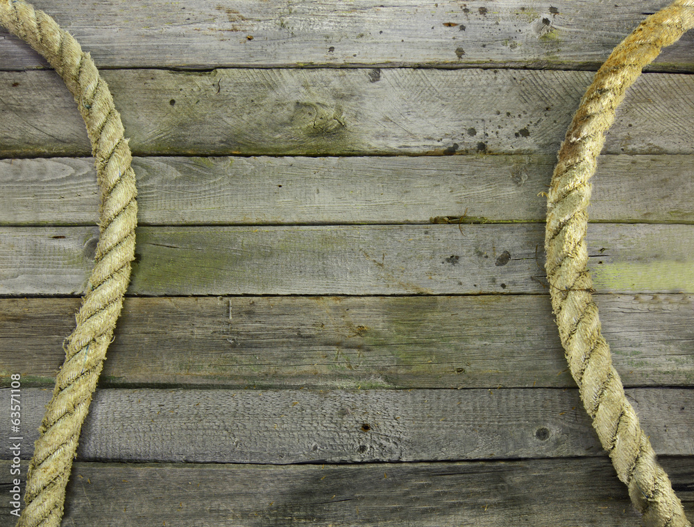 Obraz premium Wooden background with rope