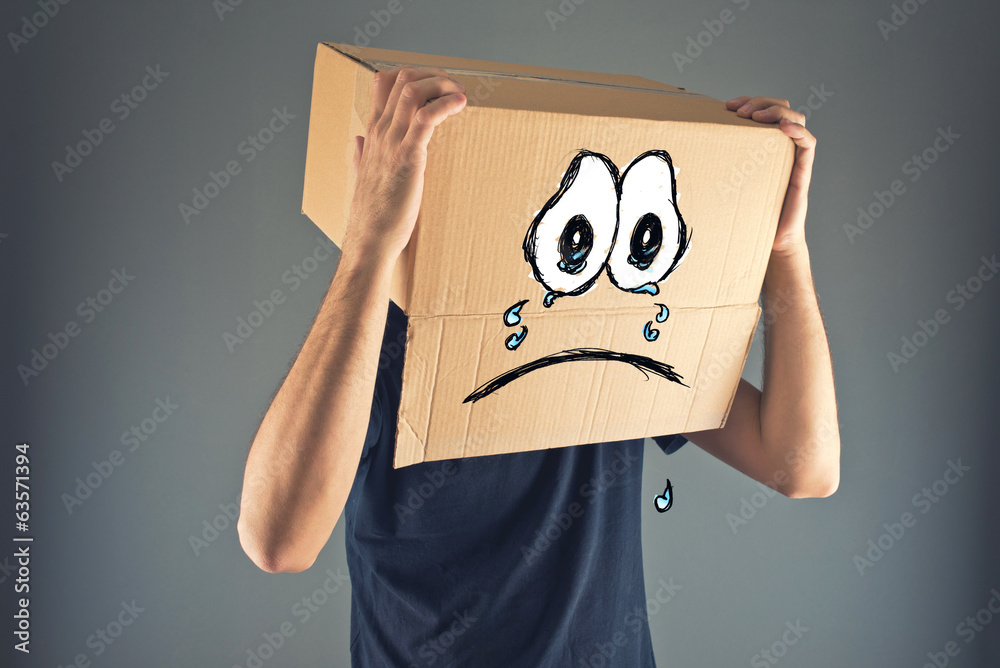 Man with cardboard box on his head and sad face expression Stock Photo |  Adobe Stock