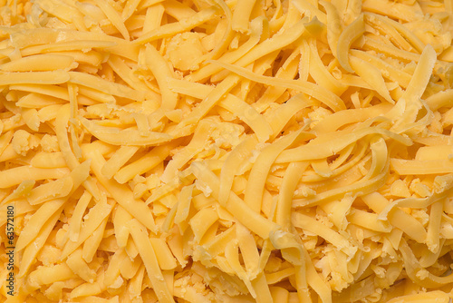 Grated cheddar cheese on a plate