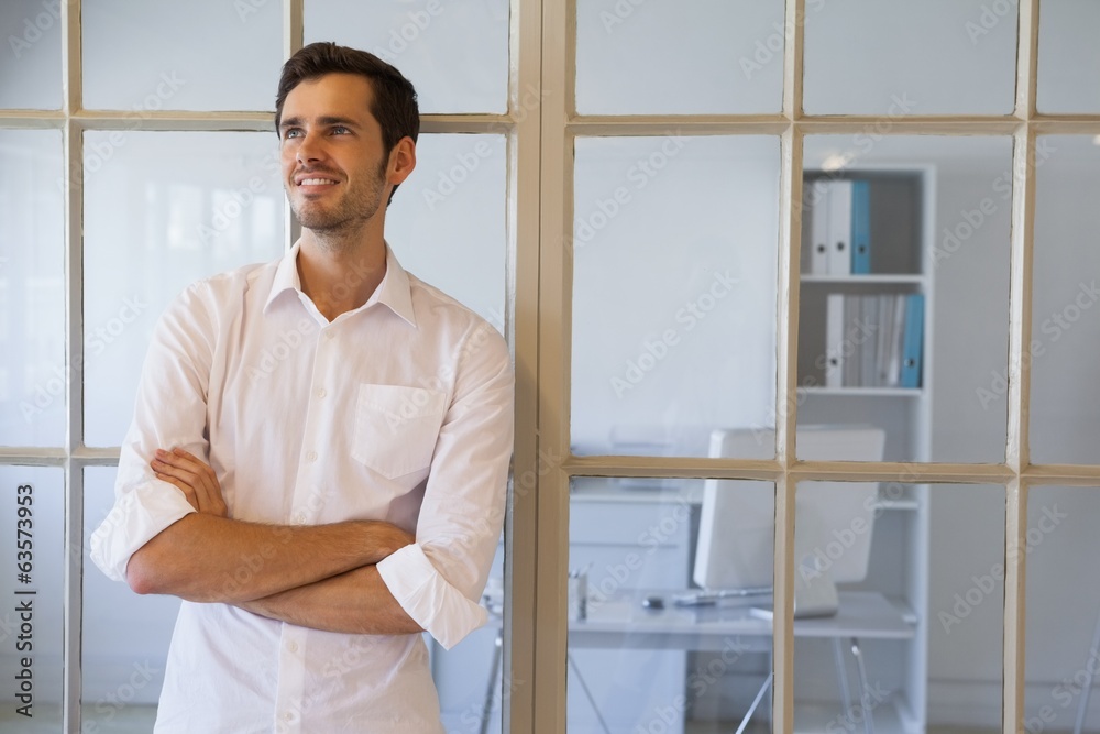Casual businessman smiling with arms crossed Casual businessman smiling with arms crossed