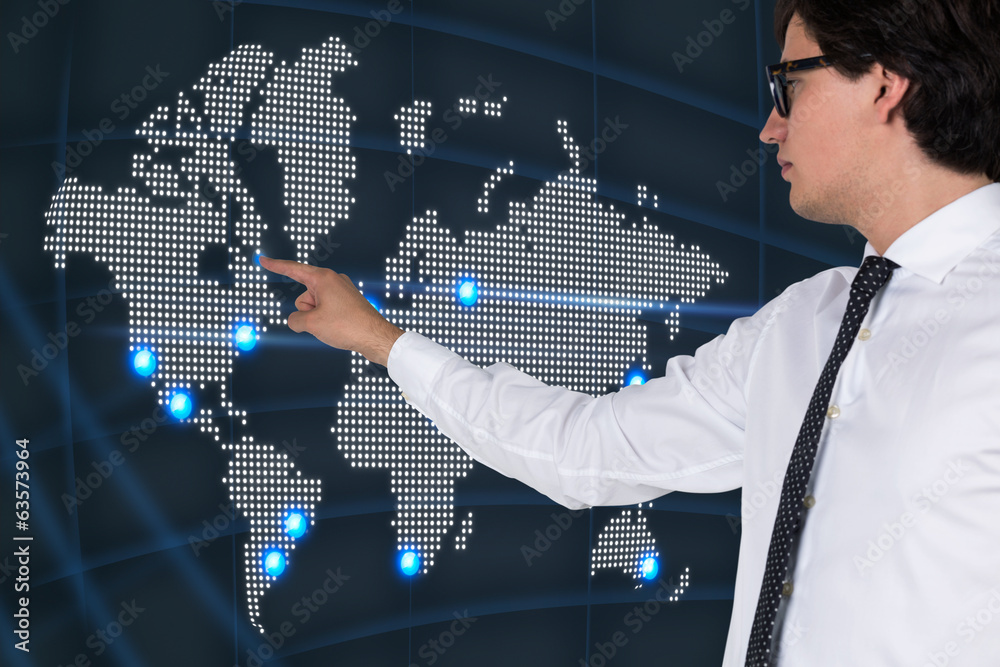 Businessman pointing out the world map Businessman pointing out the world map