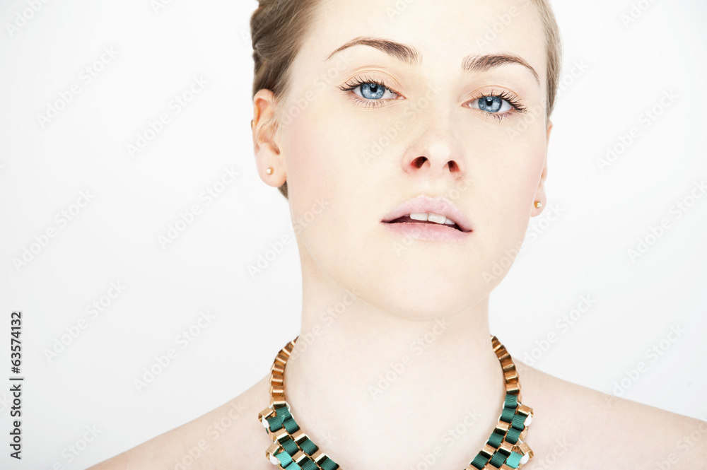 portrait of young beautiful long-haired blonde woman with neckla
