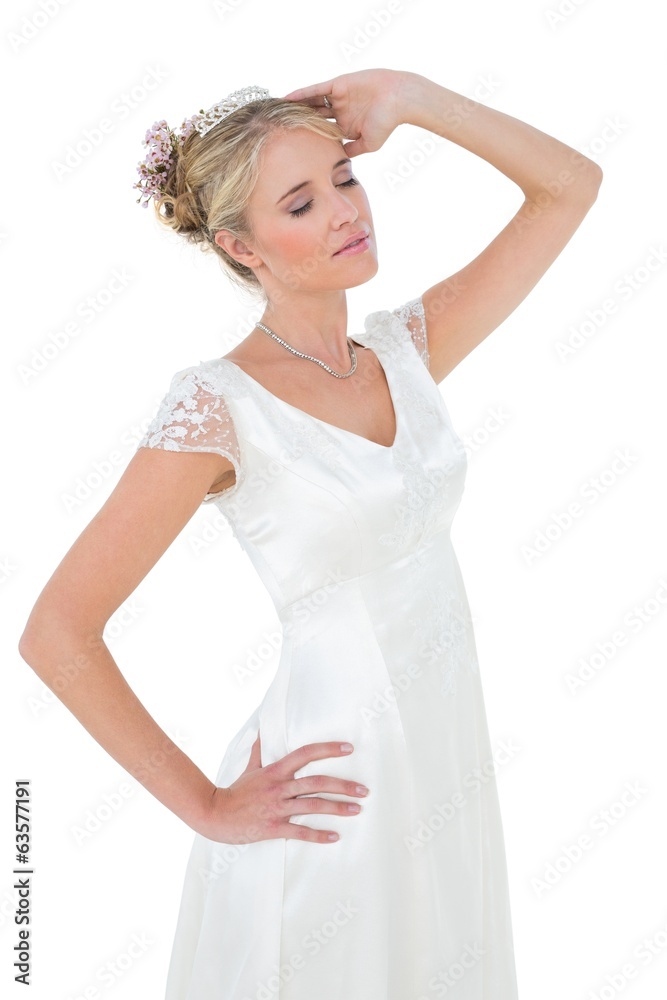 Bride with eyes closed against white background Bride with eyes closed against white background