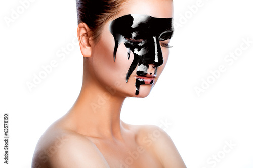 Horizontal photo of beauty woman with black paint on face