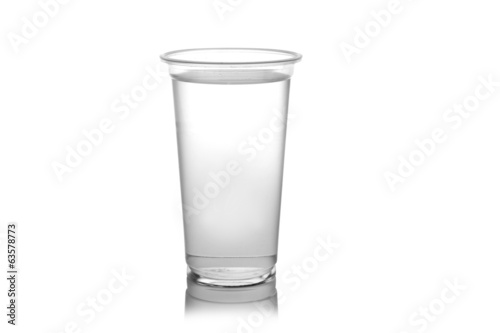 Plastic glass of water isolated on a white background.