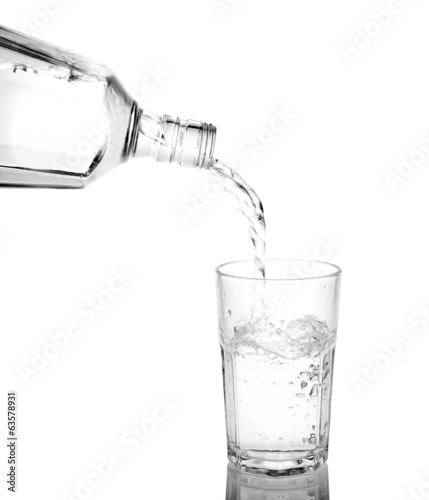 Pour into a glass isolated on a white background.