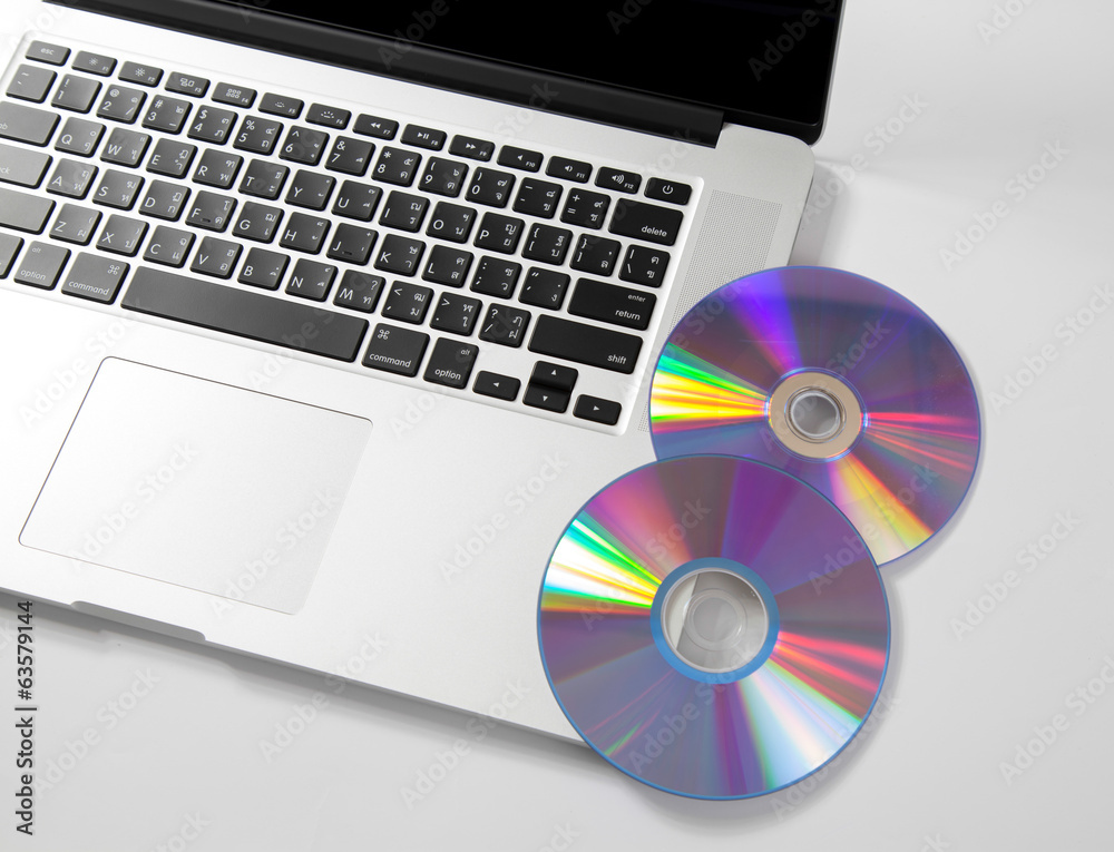 close up keyboard computer with cd on white. close up keyboard computer with cd on white.