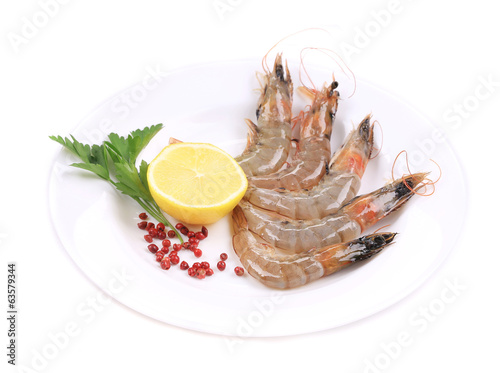 Raw shrimp with lemon and parsley.
