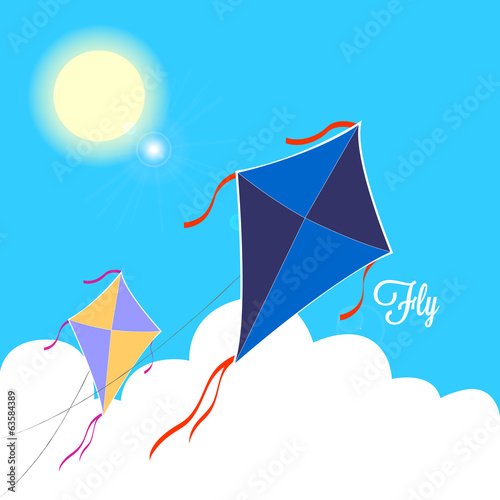kites fly on a blue sky during a clear sunny day