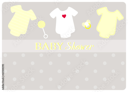 three baby bodysuits, a pacifier and a little   rattle