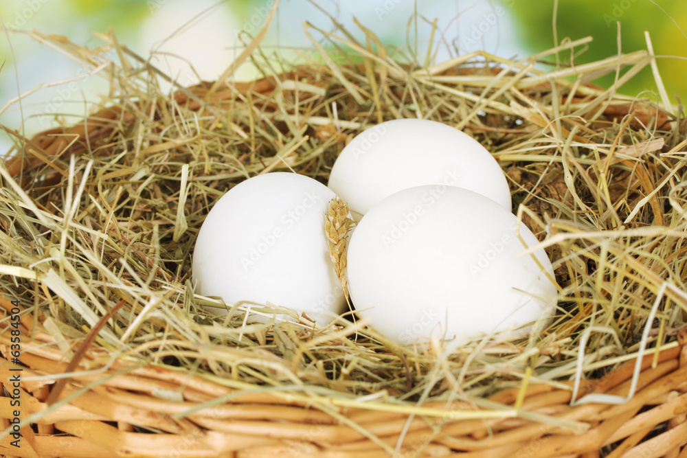 white eggs in a wicker basket