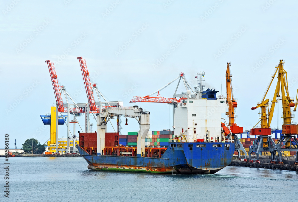 Bulk cargo ship under port crane bridge, Odessa, Ukraine