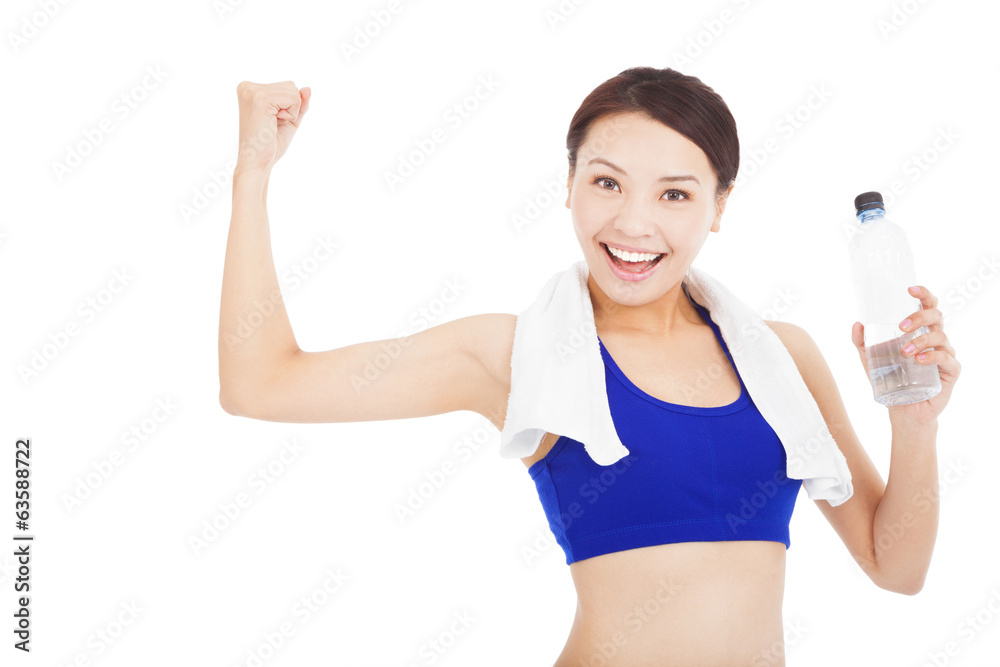 pretty woman drinking water and muscular pose pretty woman drinking water and muscular pose