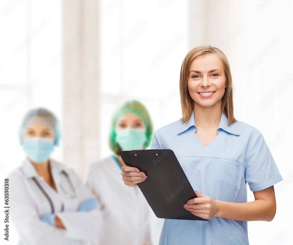 smiling female doctor or nurse with clipboard smiling female doctor or nurse with clipboard