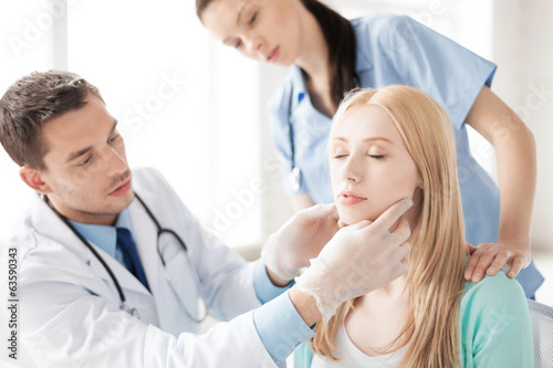 male plastic surgeon with patient photo