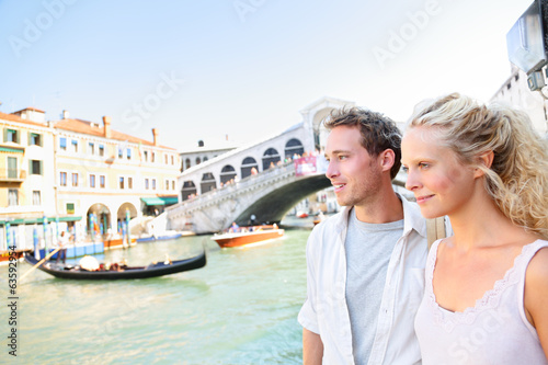 Venice couple by Rialto Bridge on Grand Canal © Maridav