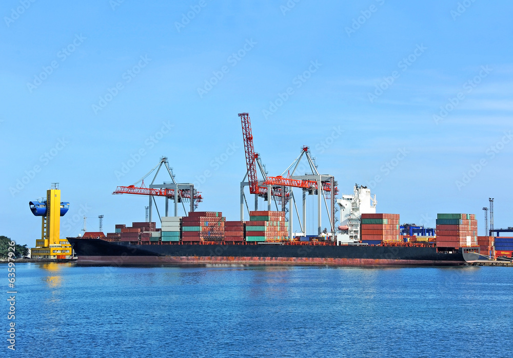 Container stack and ship under crane bridge Container stack and ship under crane bridge