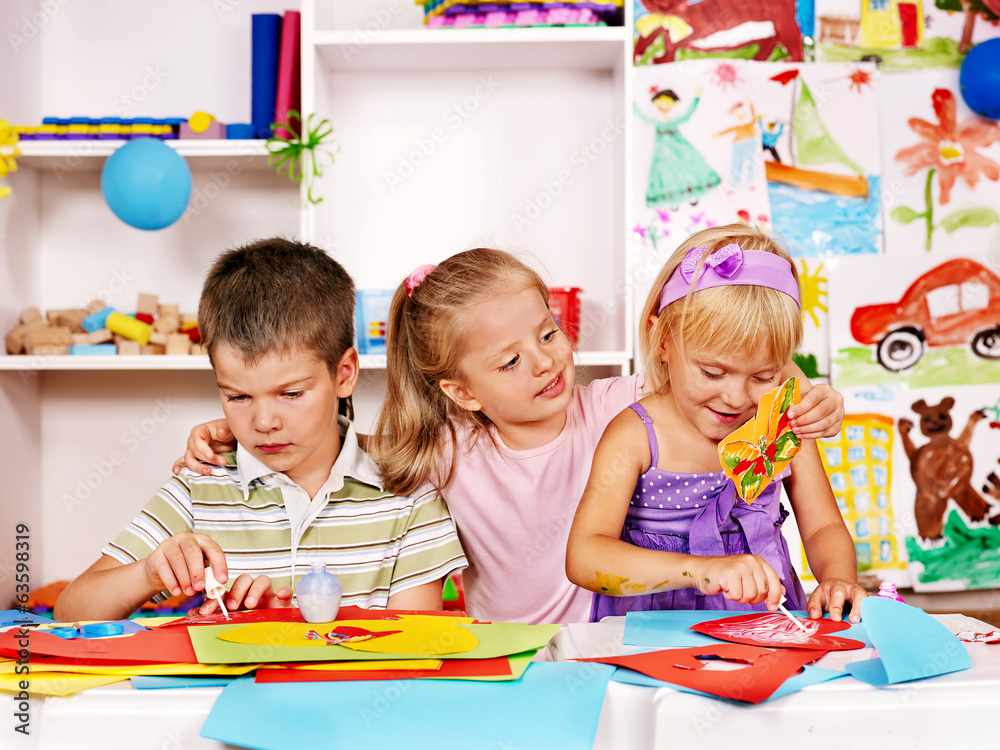 Fototapeta premium Child cutting out scissors paper.