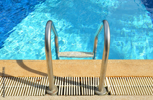 Swimming pool with stair at...