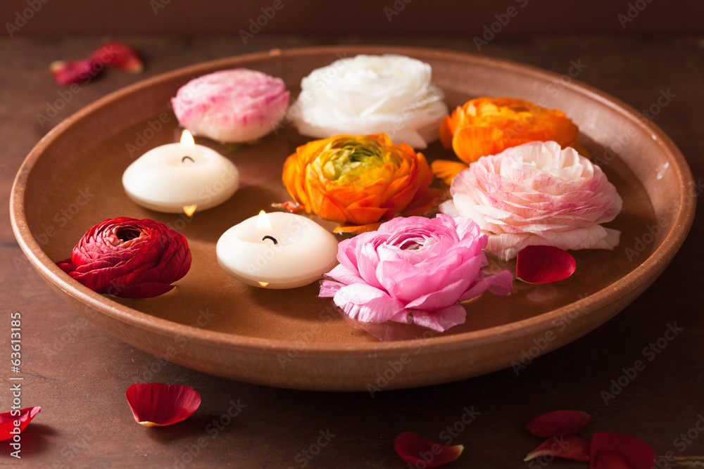 ranunculus flowers and canclles in bowl for spa ranunculus flowers and canclles in bowl for spa