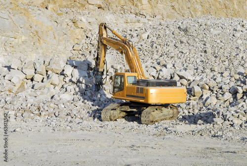 Large jackhammer smashing rocks