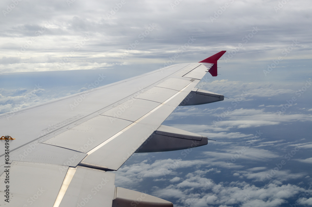 View from a jet plane window high on the blue skies